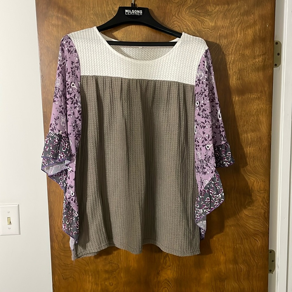 Flowy medium purple print, khaki, and white women’s top. Chiffon like sleeves.